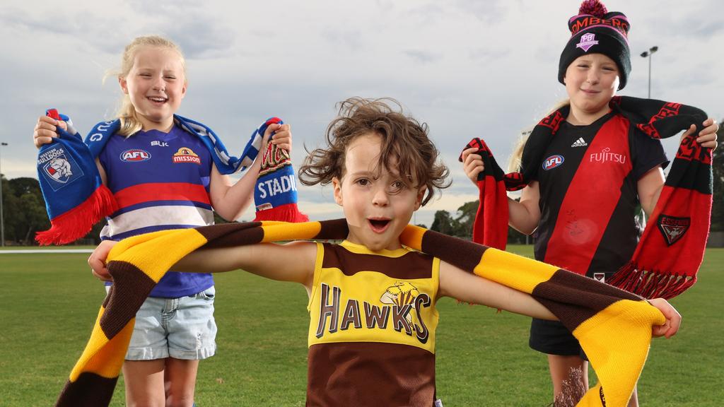 Footy fans Cooper, Gypsy and Lulu are excited for AFL to return this week. Picture: Michael Klein