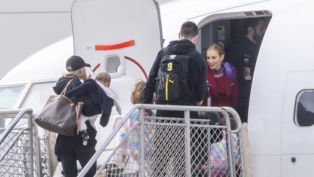 Cothcin family boarding a plane out of Melbourne. Picture: Wayne Taylor