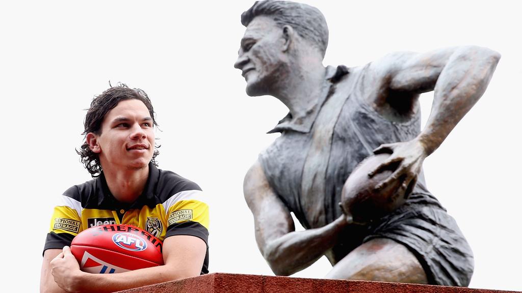Daniel Rioli poses next to the Jack Dyer statue at Punt Road Oval in 2017. Picture: Getty Images
