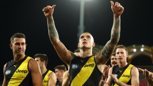 Dustin Martin and his Tigers team mates celebrate winning in round 17. 